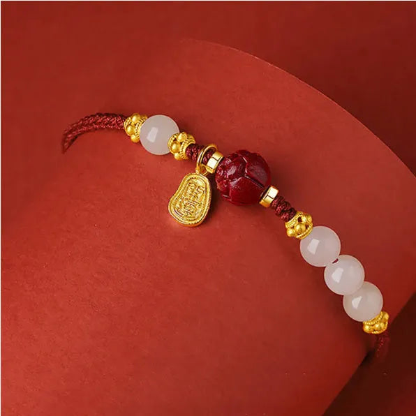 Women's adjustable 925 silver bracelet with Hetian jade and cinnabar red rope design on wrist