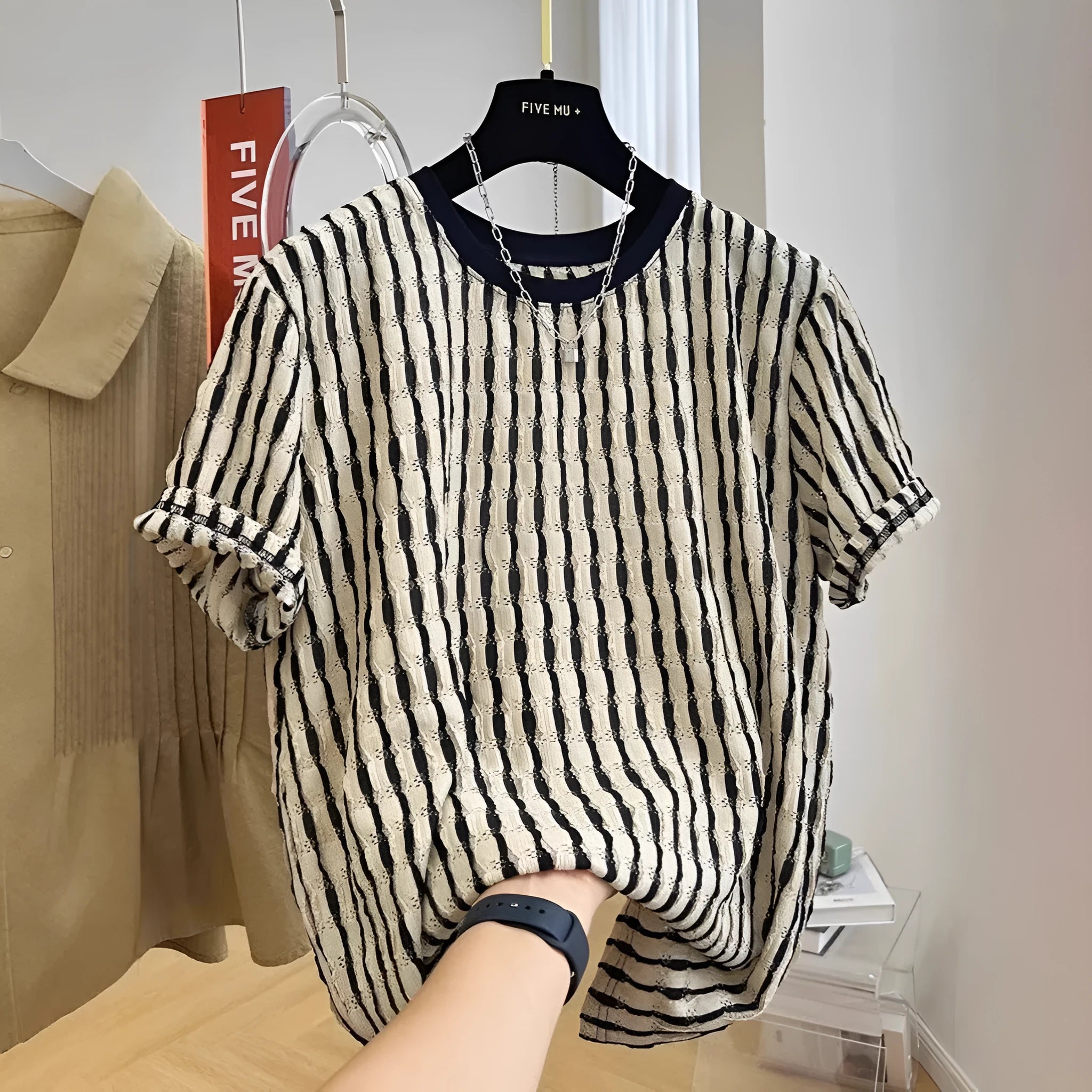 Black men's casual shirt with white stripes, loose fit with short sleeves, made from silk and linen.