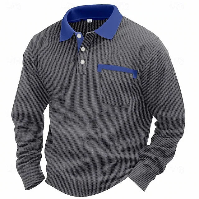 Man wearing a long-sleeved waffle knit polo shirt in a solid colour with an asymmetric design detail.