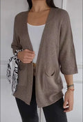 Women's army green waffle weave cardigan coat with nine-quarter length sleeves and pockets.