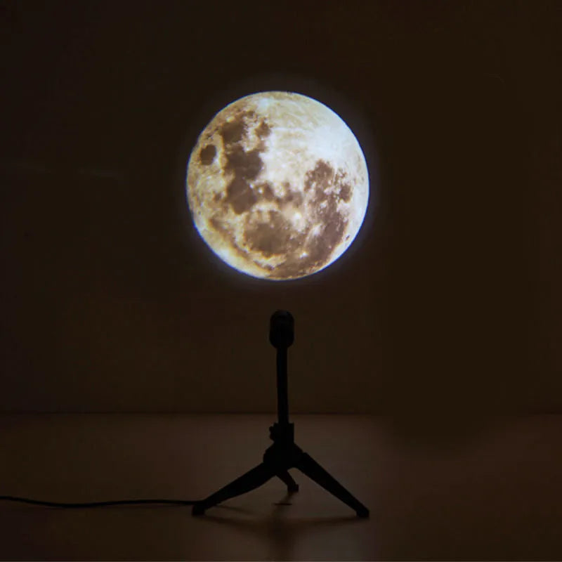 Earth and Moon LED projector lamp with adjustable rotating bracket on wooden surface