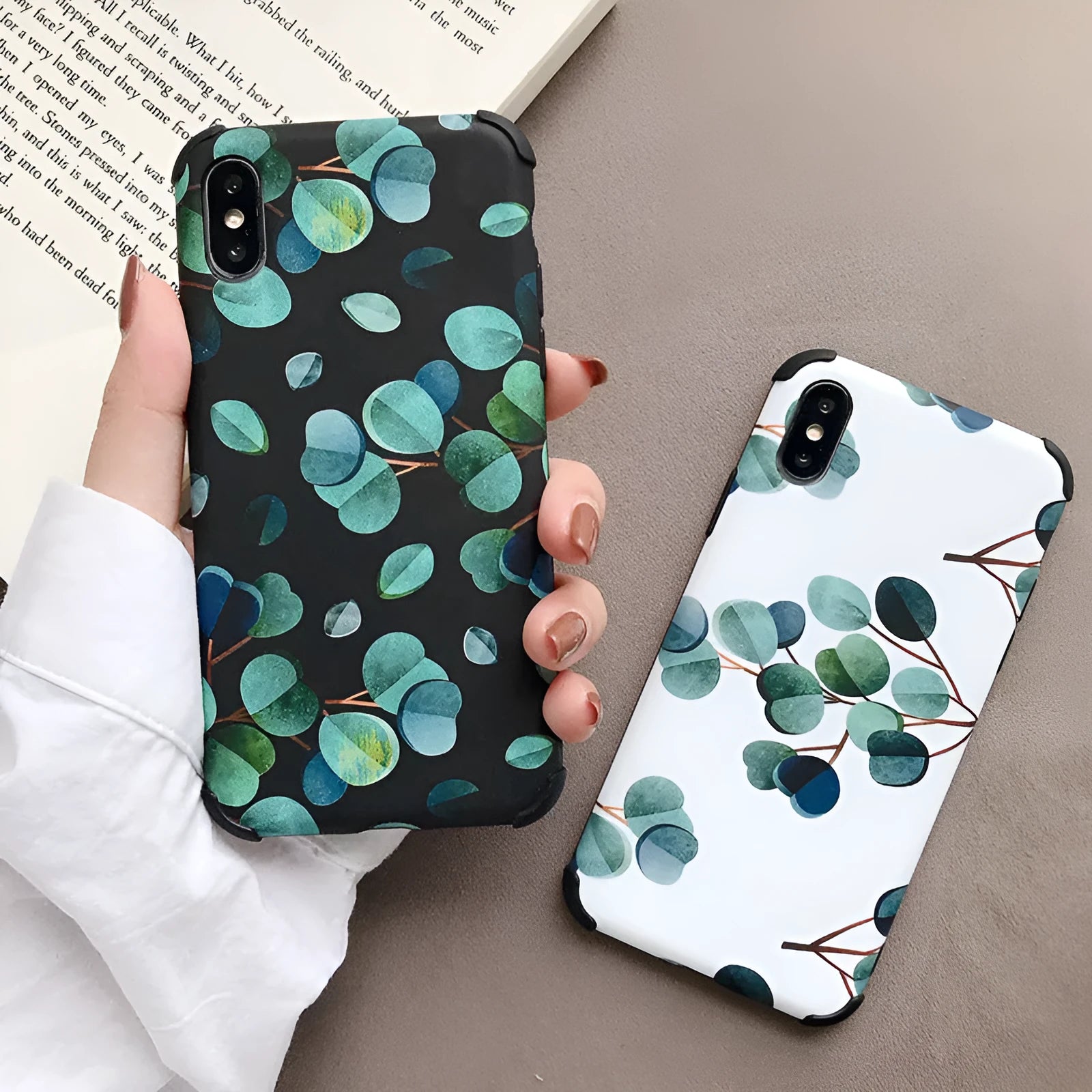Black silicone leaf design phone case for iPhone models on a plain background.