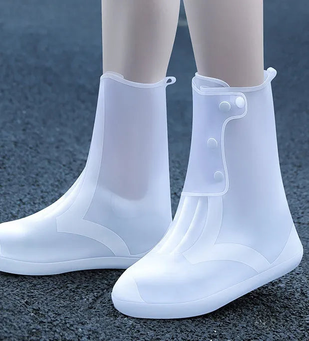 White high-top PVC reusable waterproof shoe covers for women with size chart showing measurements