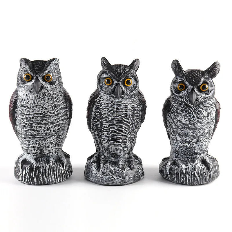 Three-piece set of red artificial PE plastic owl garden ornaments on a white background