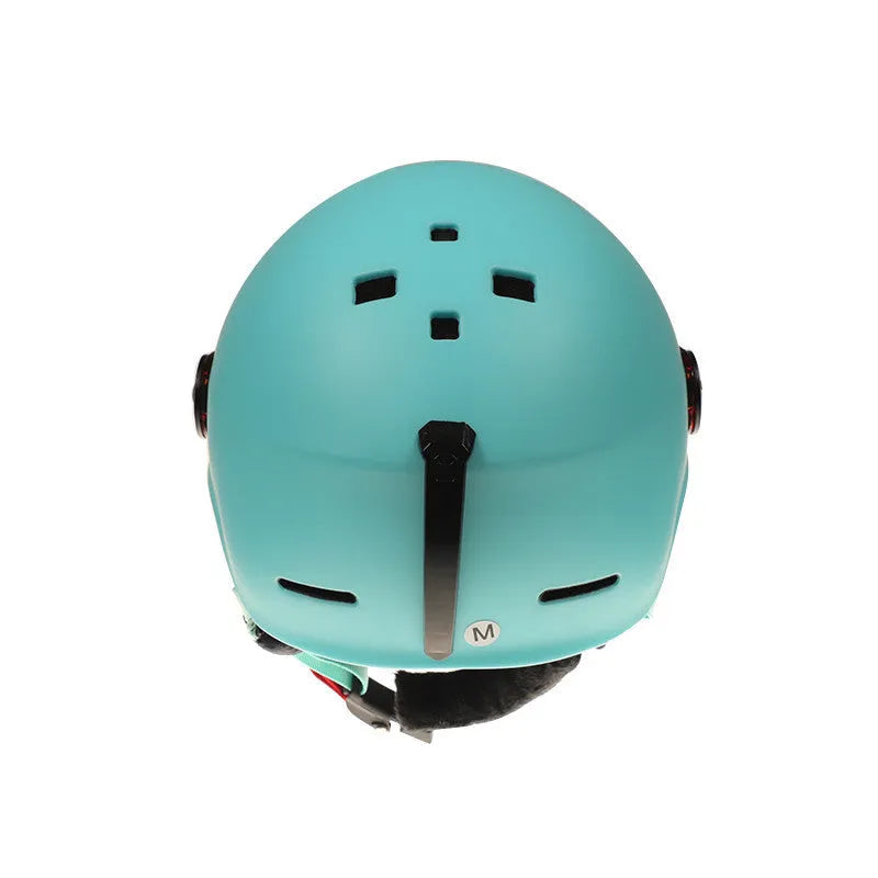 Moon ski helmet in black with polycarbonate shell and retractable visor on white background