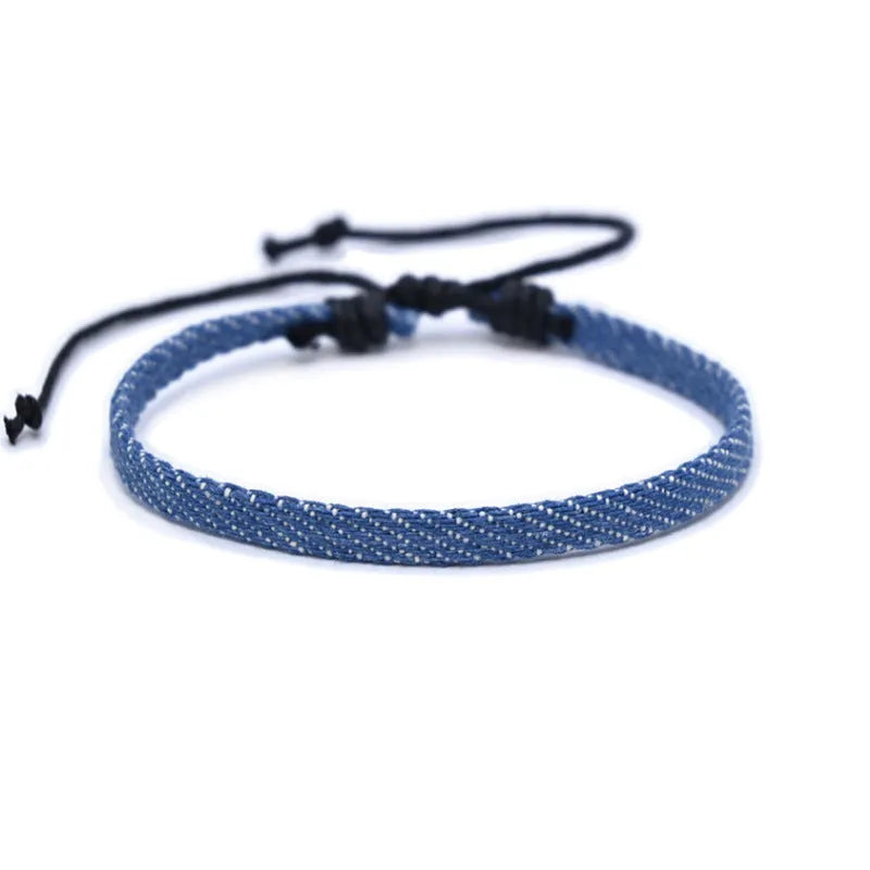 Denim fabric bracelet carrying strap with mixed materials, unisex design for travel