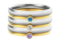 Geometric titanium steel ring with engraved December birthstone design on a hand.