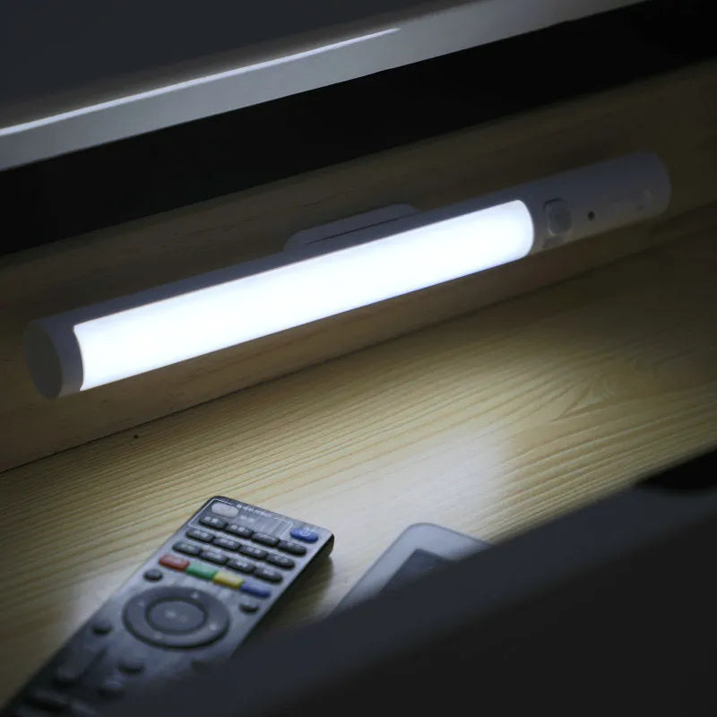 Infrared sensor battery LED wall light with magnetic mount showing cylindrical white housing