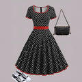 Multicolour polka dot women's dress with a square collar, short sleeves, and a pleated midi skirt.
