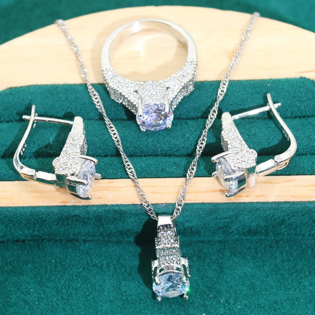 Bridal zircon four-piece jewellery set showing necklace, bracelet, earrings and ring with alloy pendant material