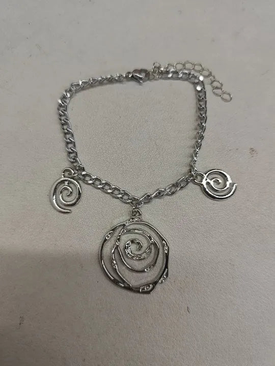 Spiral donut design alloy necklace, bracelet and earrings set in gold or silver electroplated finish.