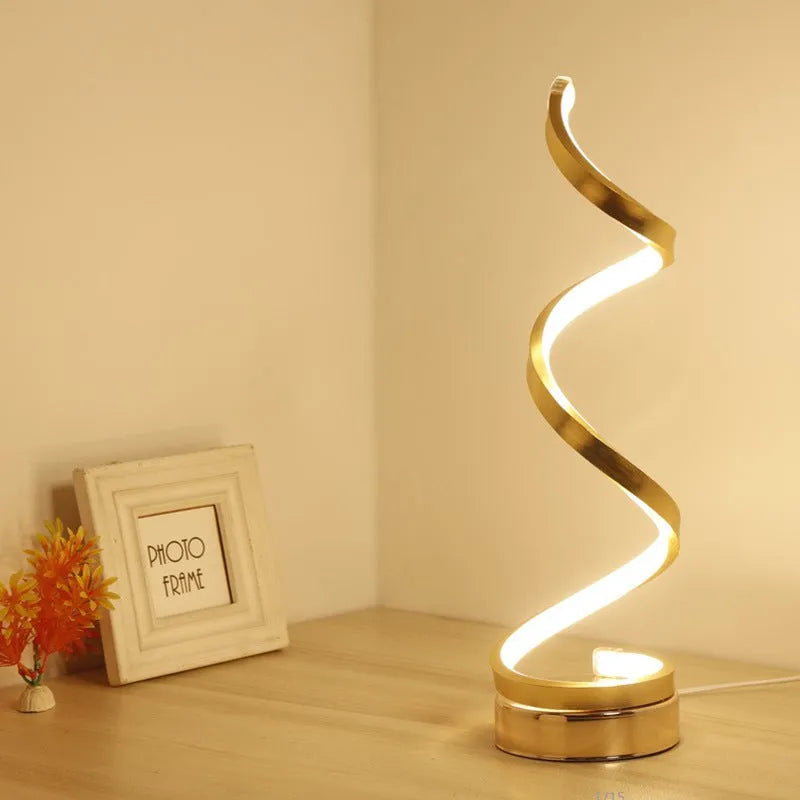 Minimalist black LED table lamp with aluminium shade and tri-colour dimming on wooden bedside table