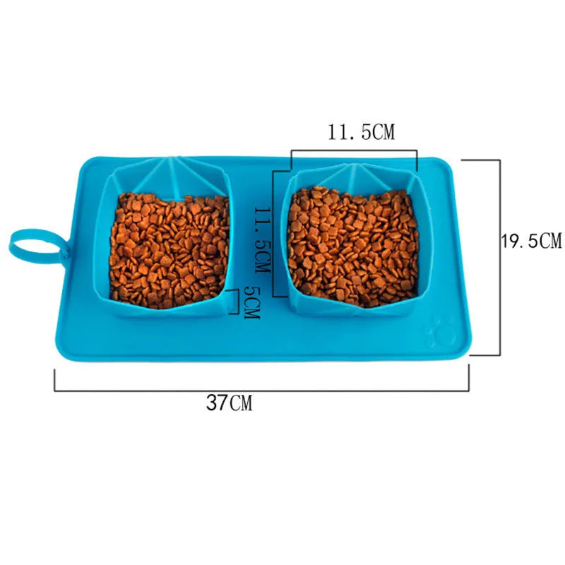 Collapsible silicone pet bowl in blue grey with velvet carry bag on a light background