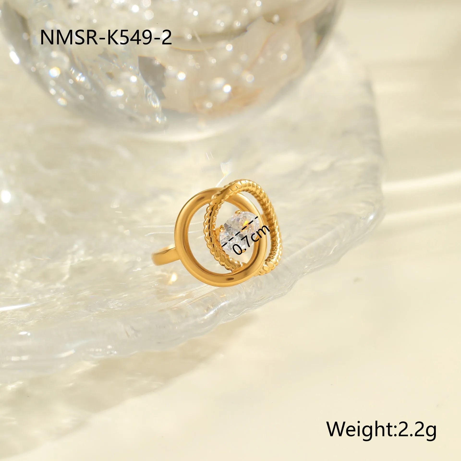 Gold-coloured adjustable stainless steel ring with zircon geometric shapes on white background.