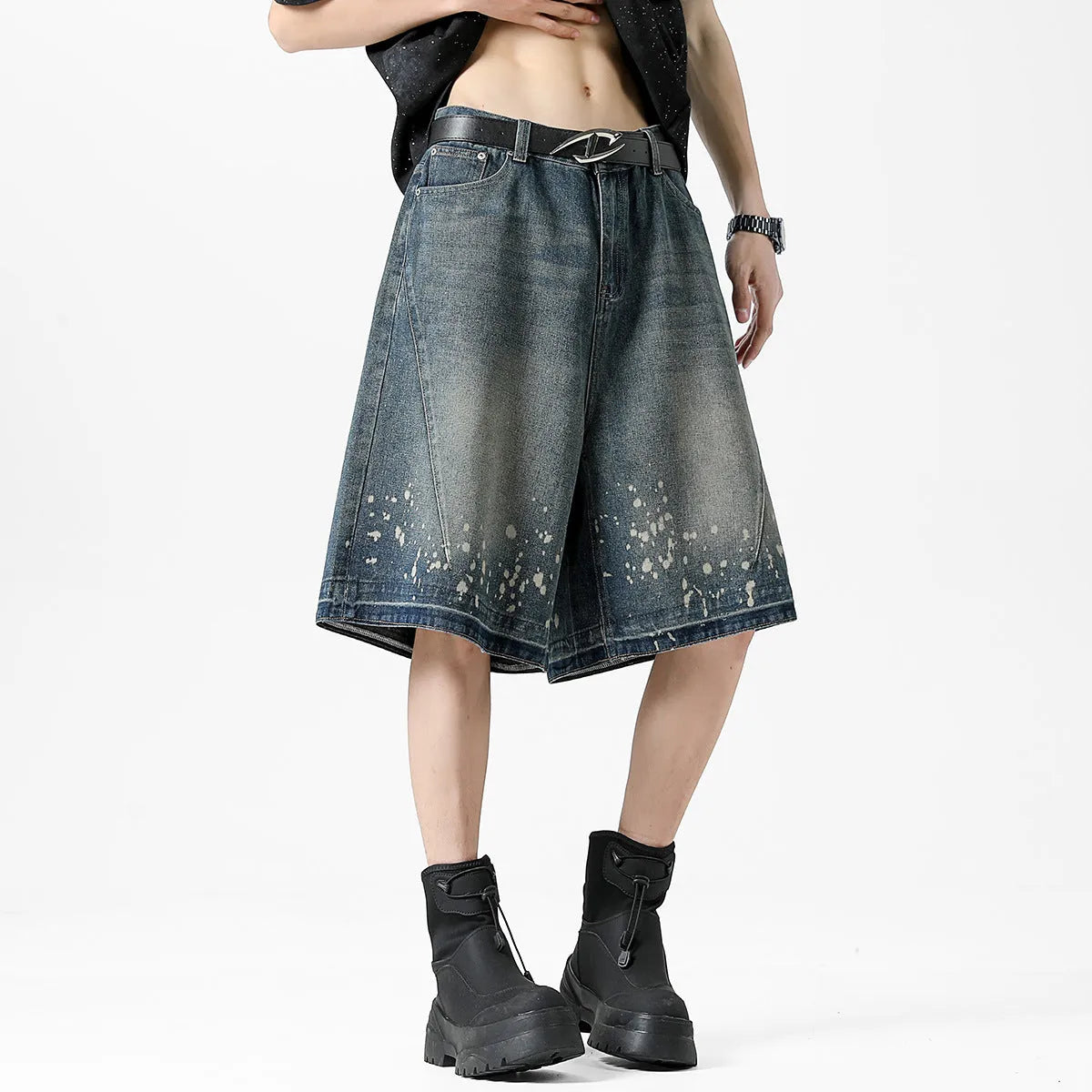 Men's retro blue denim shorts with distressed splash ink design and straight leg cut.