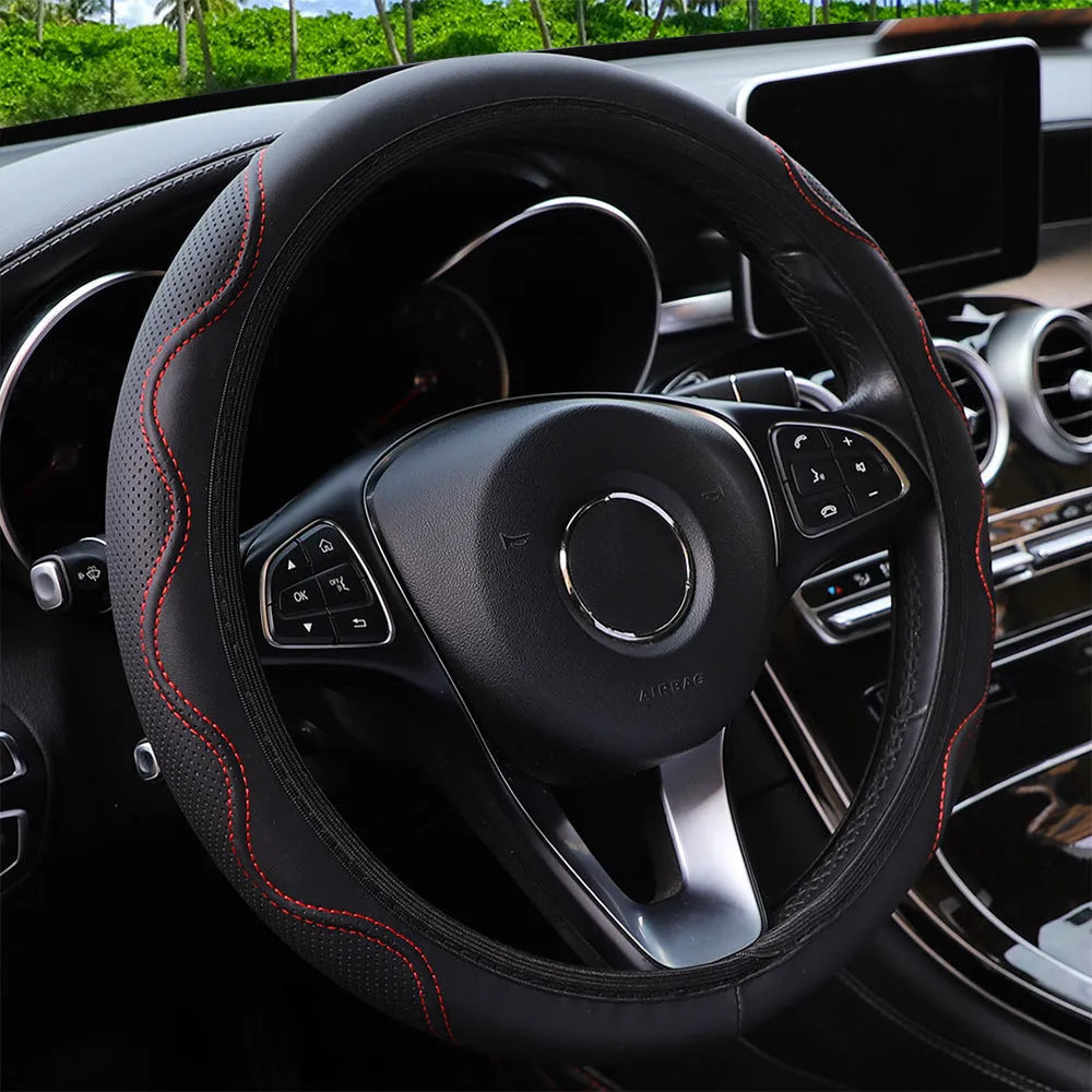Black elastic steering wheel cover with corrugated texture, stretched to show fit on a 37-38cm wheel.