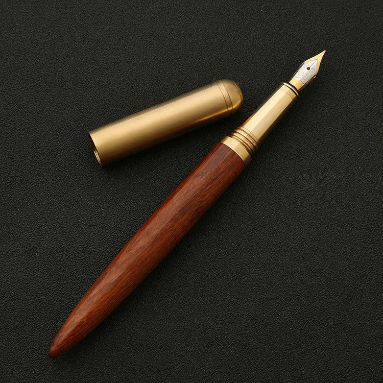 Brass and sandalwood solid wood signature pen with wooden barrel and brass fittings on a desk