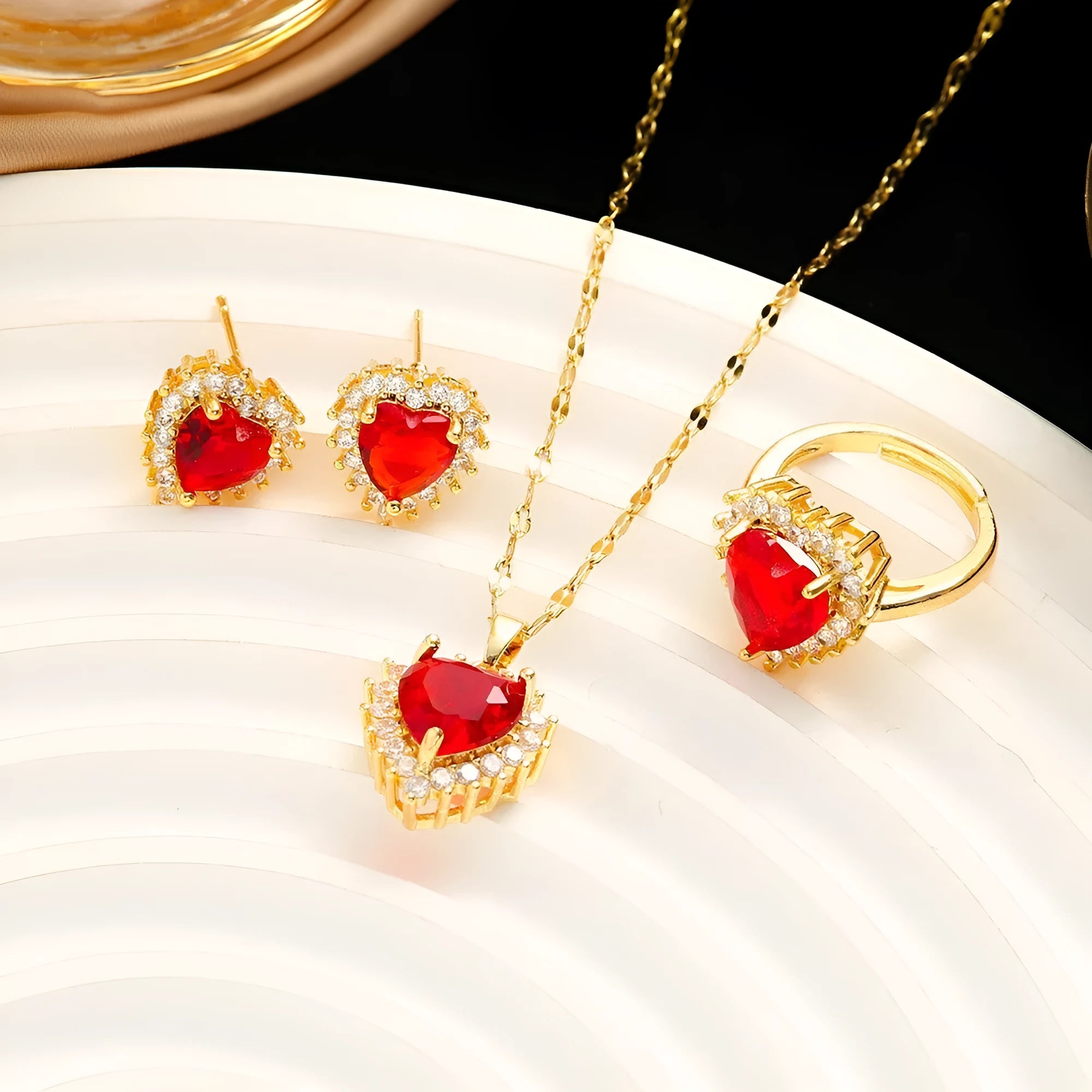 Gold-red titanium steel jewellery set with heart flower pendant necklace, stud earrings, and ring.
