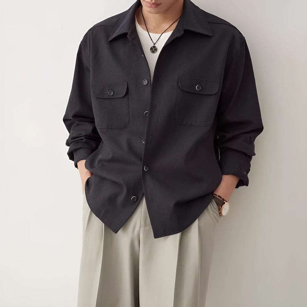 Men's long sleeve lapel shirt in light sand rice colour, showing collar detail and stitching.