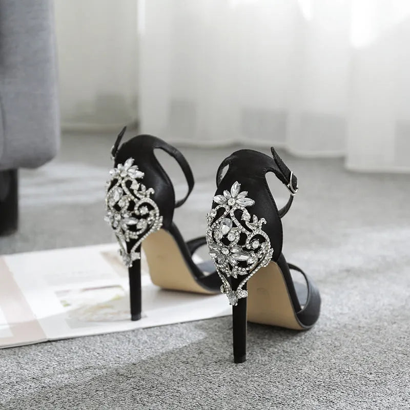 Black suede women's high heel shoes with rhinestone detail on a 6-8cm heel.