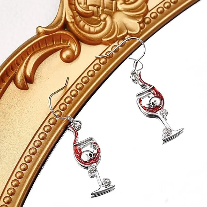 A pair of zinc alloy electroplated earrings with a combined skull and wine glass geometric design.