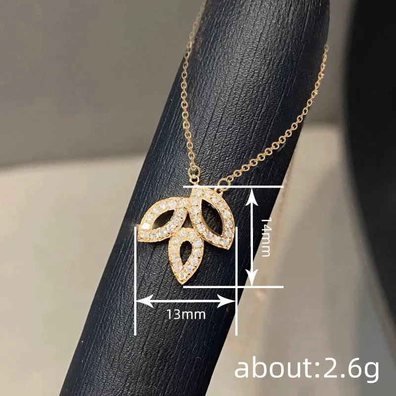 Women's yellow gold hollow leaf necklace with inlaid zircon and adjustable O-ring copper chain