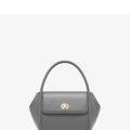 Women's leather wing-shaped tote bag with buckle closure in blue, grey, black, or brown colour options