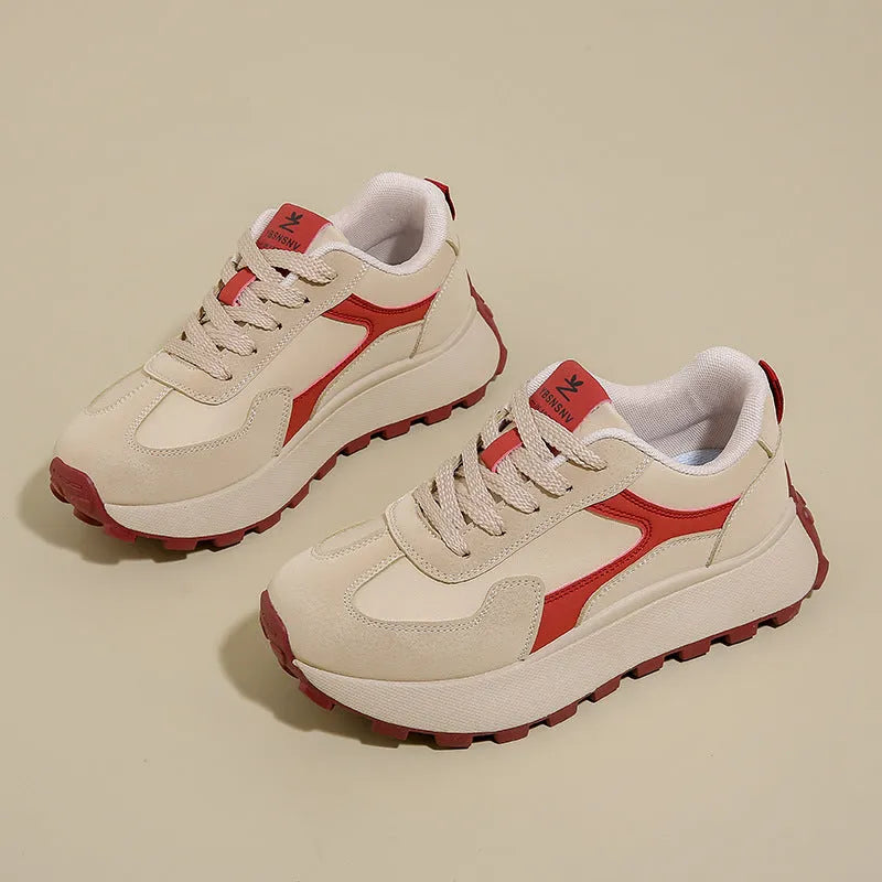 Women's low-top platform running shoes in black, red, or grey with lace-up front and flat rubber sole.