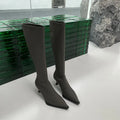 Women's black pointed toe stiletto heel boots with a back zip closure