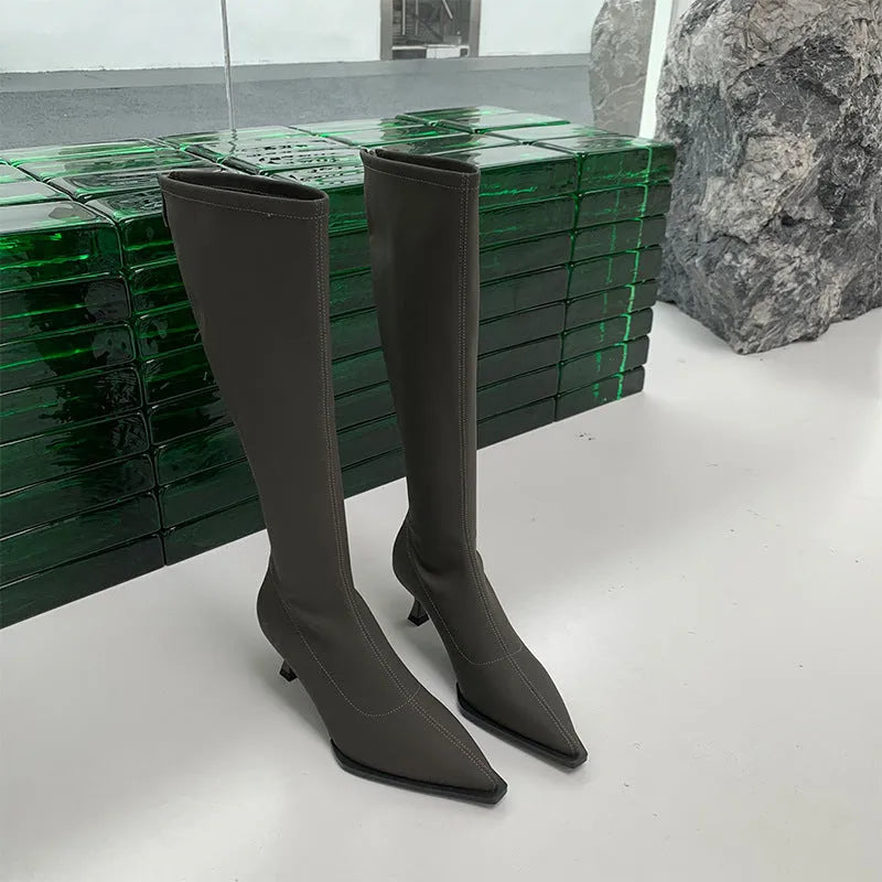 Women's black pointed toe stiletto heel boots with a back zip closure
