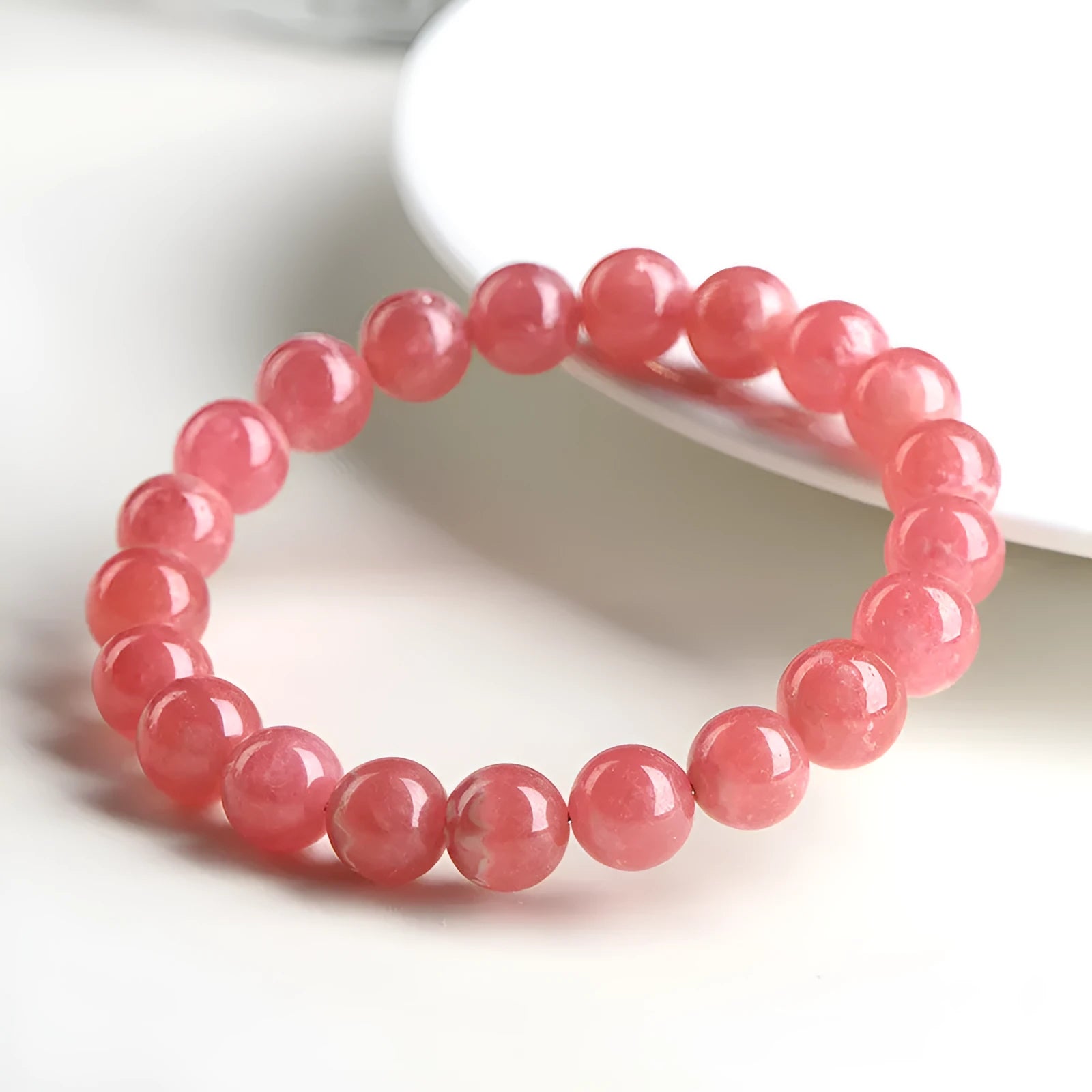Women's geometric crystal bracelet with longevity lock fastening in rhodochrosite colour with multiple bead size options