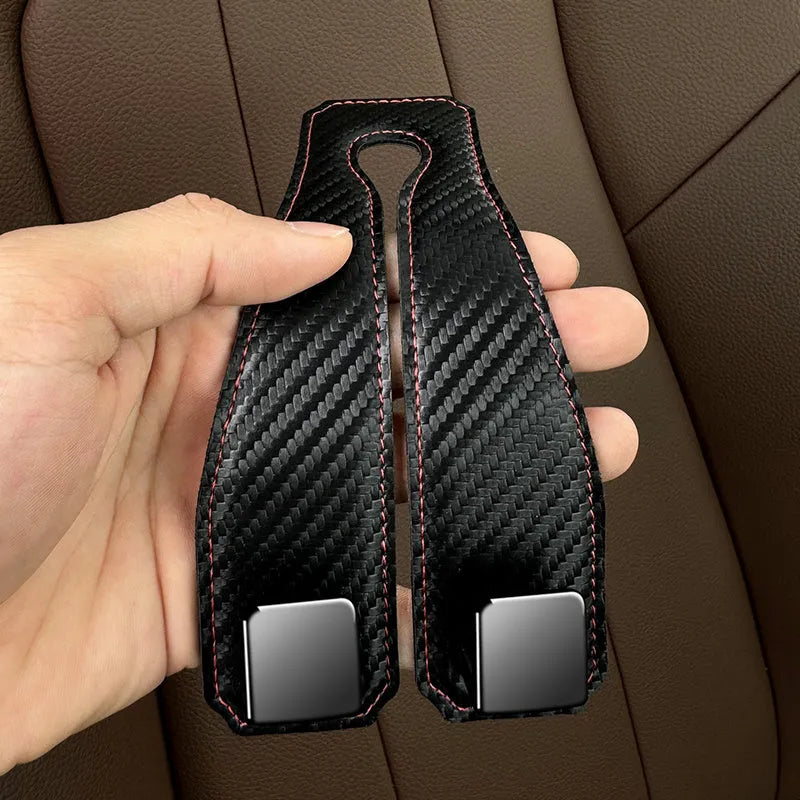 Black carbon fibre metal car hook clipped to headrest with 25kg load capacity
