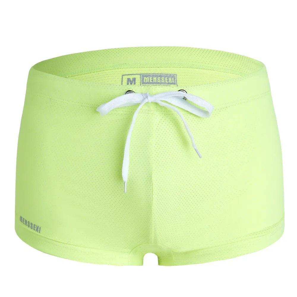 Men's low-waist boxer style swimming trunks with lace detailing in nylon fabric