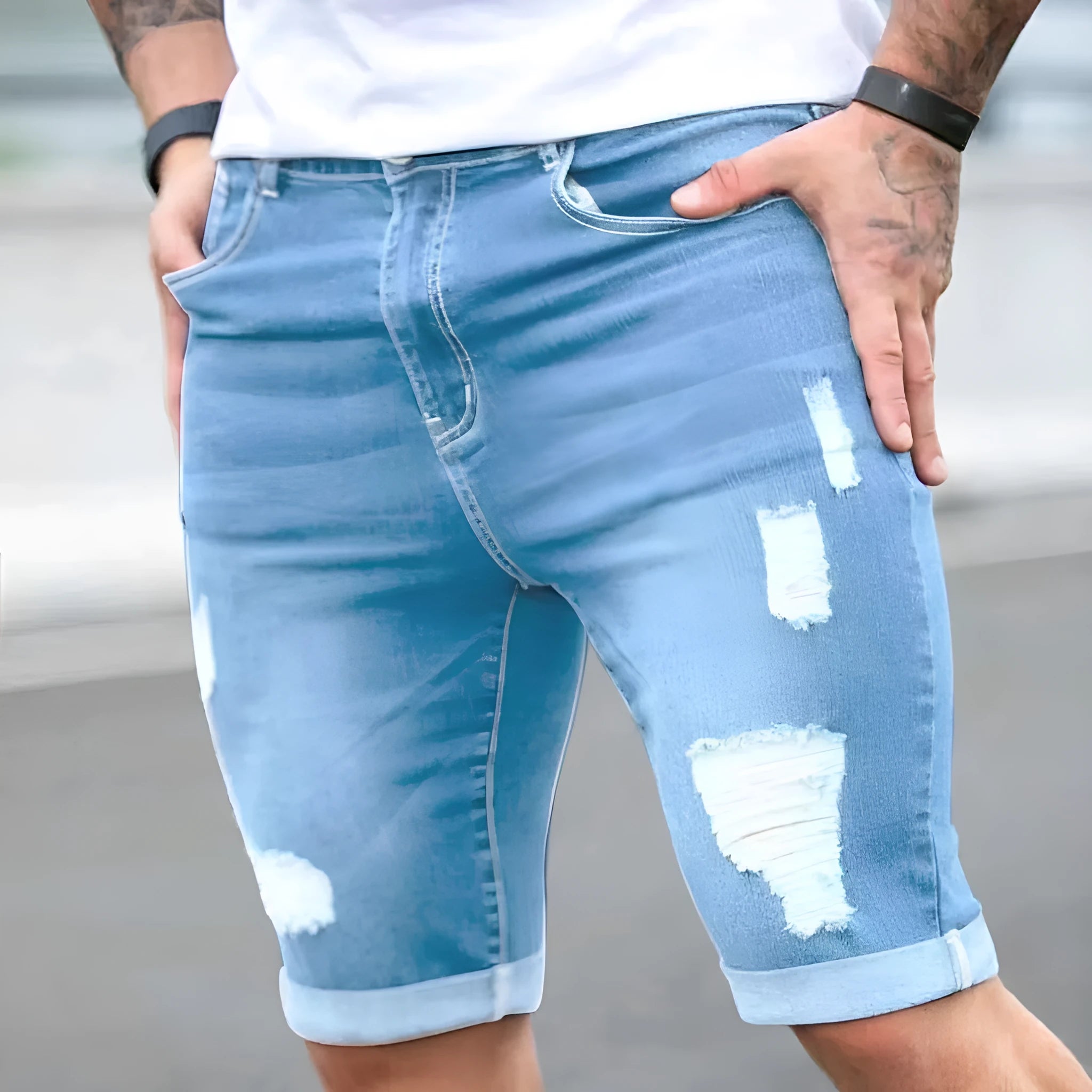Sky blue denim shorts with distressed holes and low waist design
