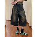 Men's loose straight-leg denim shorts in blue, shown with a fifth pants length for summer.