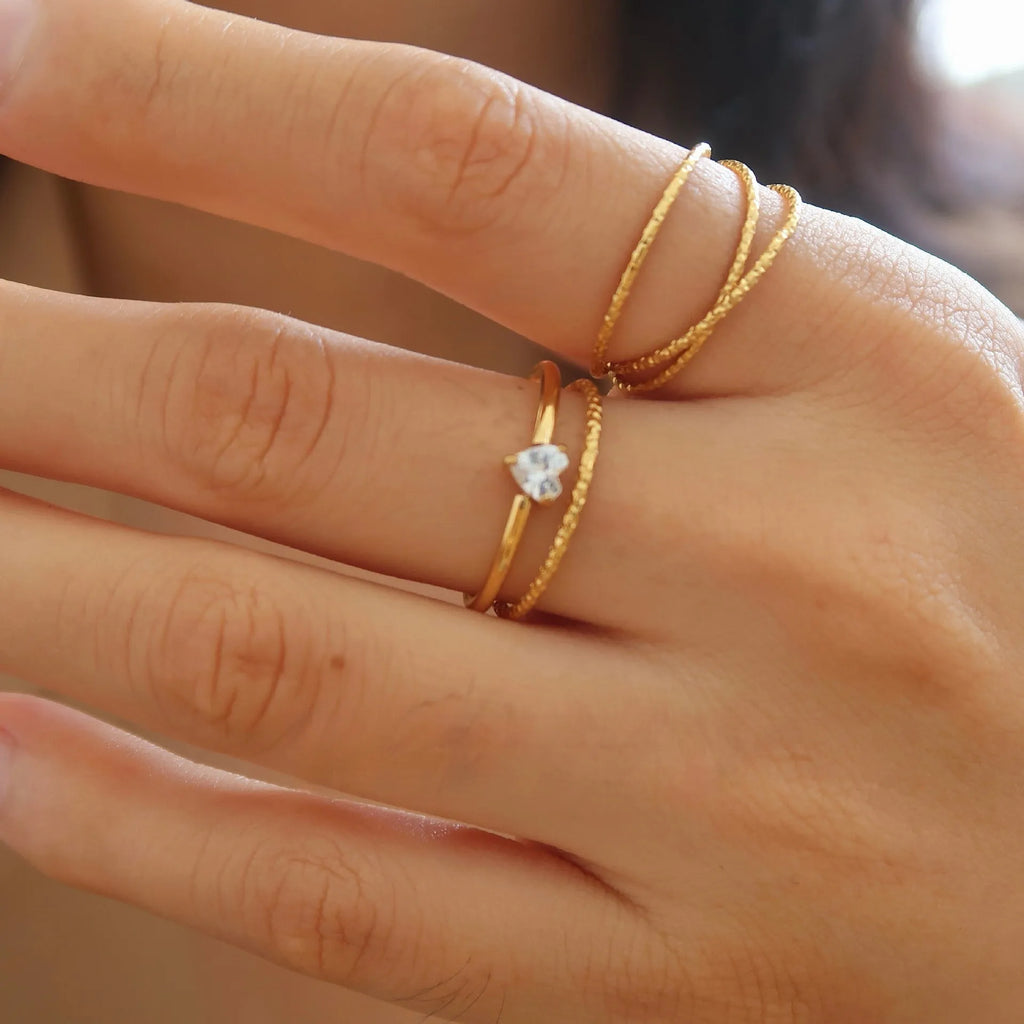 Golden electroplated stainless steel ring with love heart shape and oval bath design