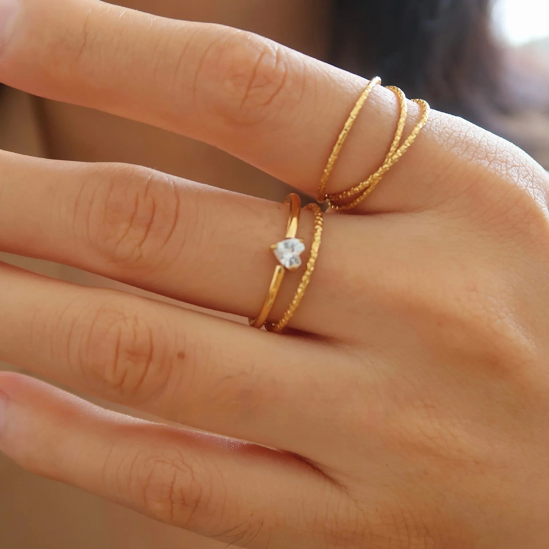 Golden electroplated stainless steel ring with love heart shape and oval bath design