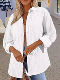 Women's solid colour knitted cardigan in black, shown open-front with long sleeves and contrast trim detail.