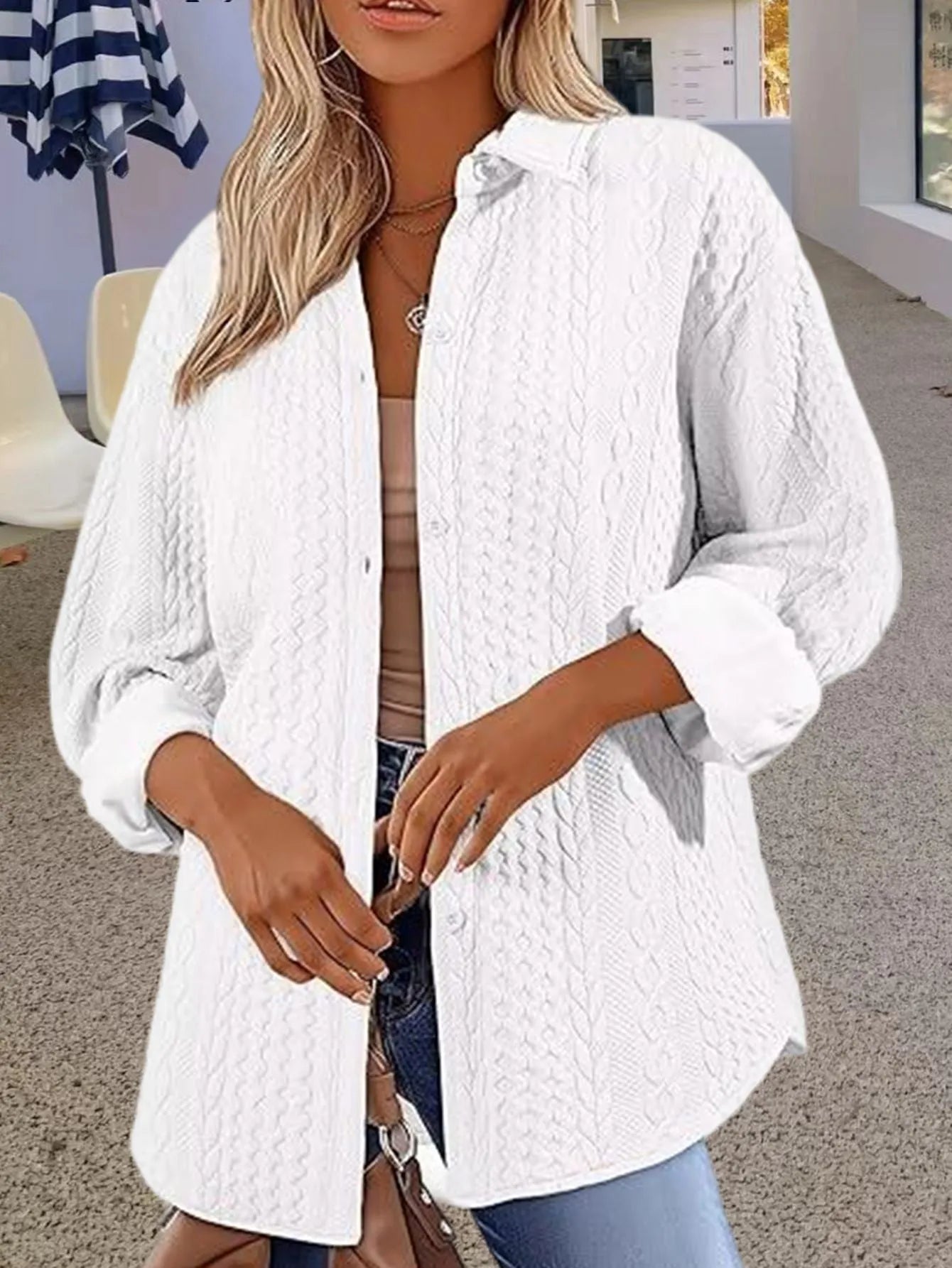 Women's solid colour knitted cardigan in black, shown open-front with long sleeves and contrast trim detail.