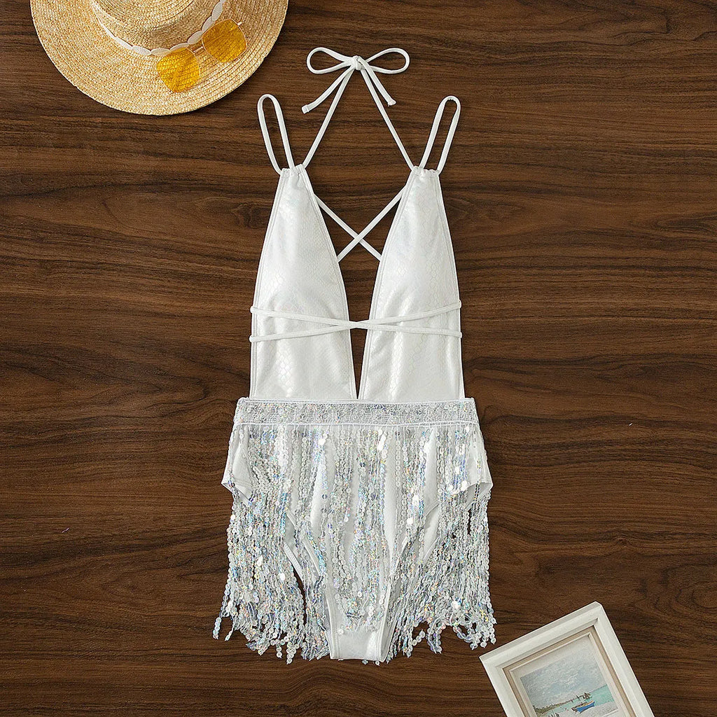 White deep V-neck one-piece swimsuit with tassel detailing on mannequin
