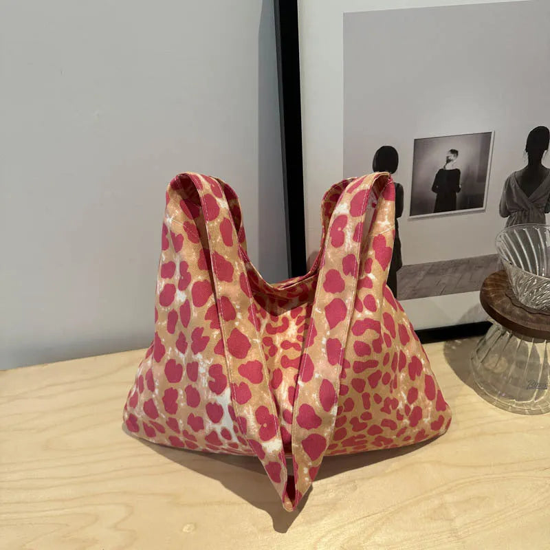 Leopard print shoulder messenger bag with square vertical shape and single strap, available in black, brown, and pink