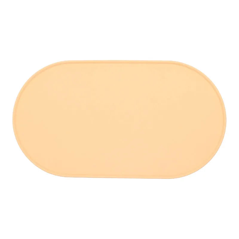Green silicone waterproof cat feeding placemat with non-slip backing under a food bowl