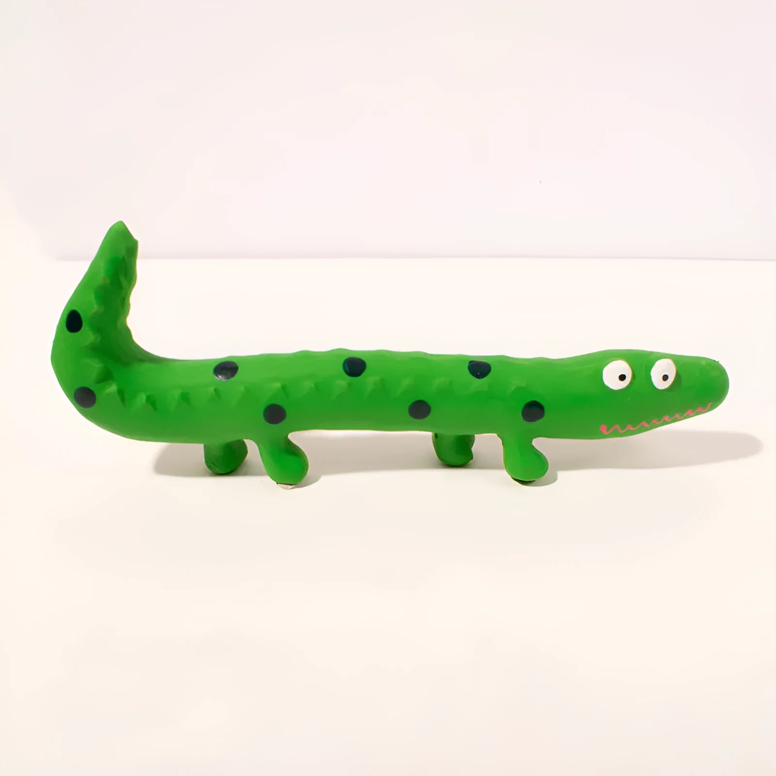 Green lizard-shaped dog chew toy with squeaker for aggressive chewing and teeth cleaning