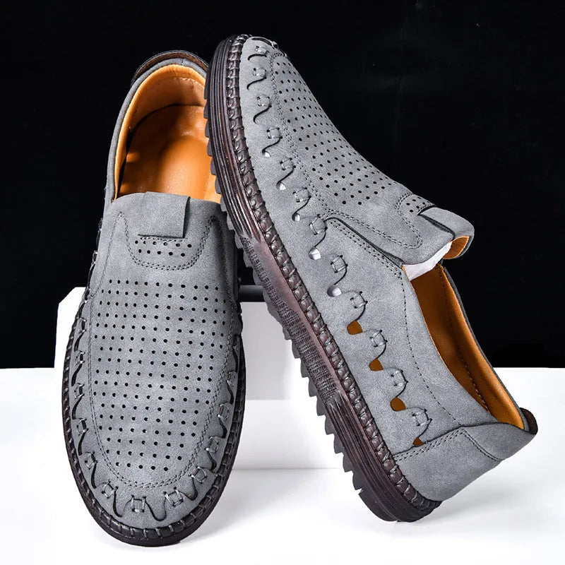 Men's brown slip-on casual leather shoes with round toe and flat heel on a white background.