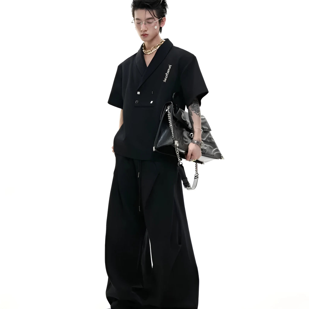 Men's dark grey cotton sports suit with metal embellishments, V-neck design, and padded shoulders