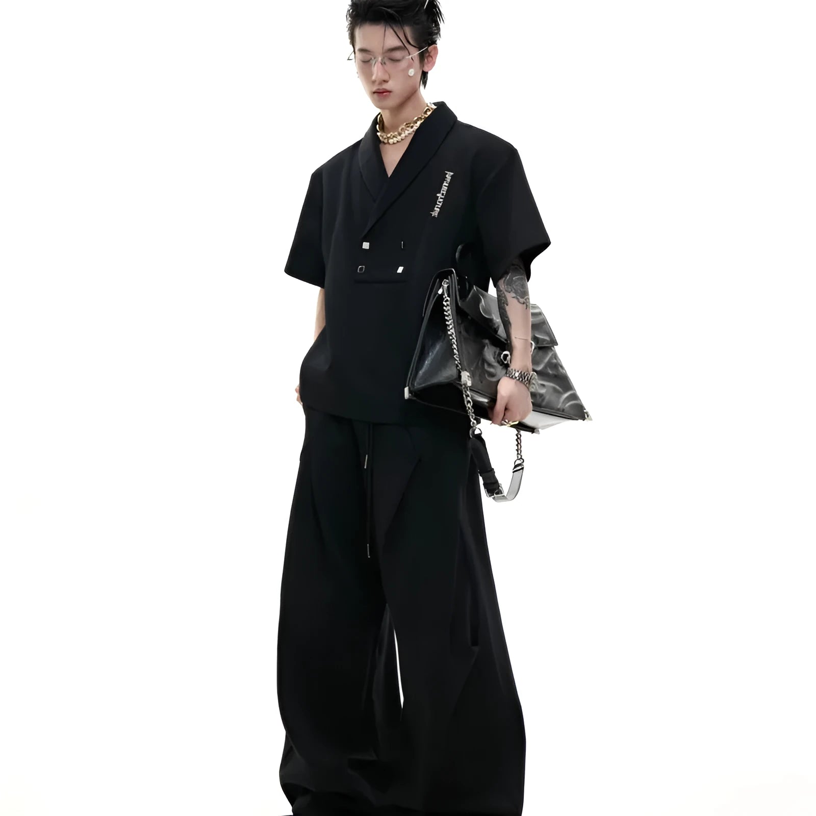 Men's dark grey cotton sports suit with metal embellishments, V-neck design, and padded shoulders