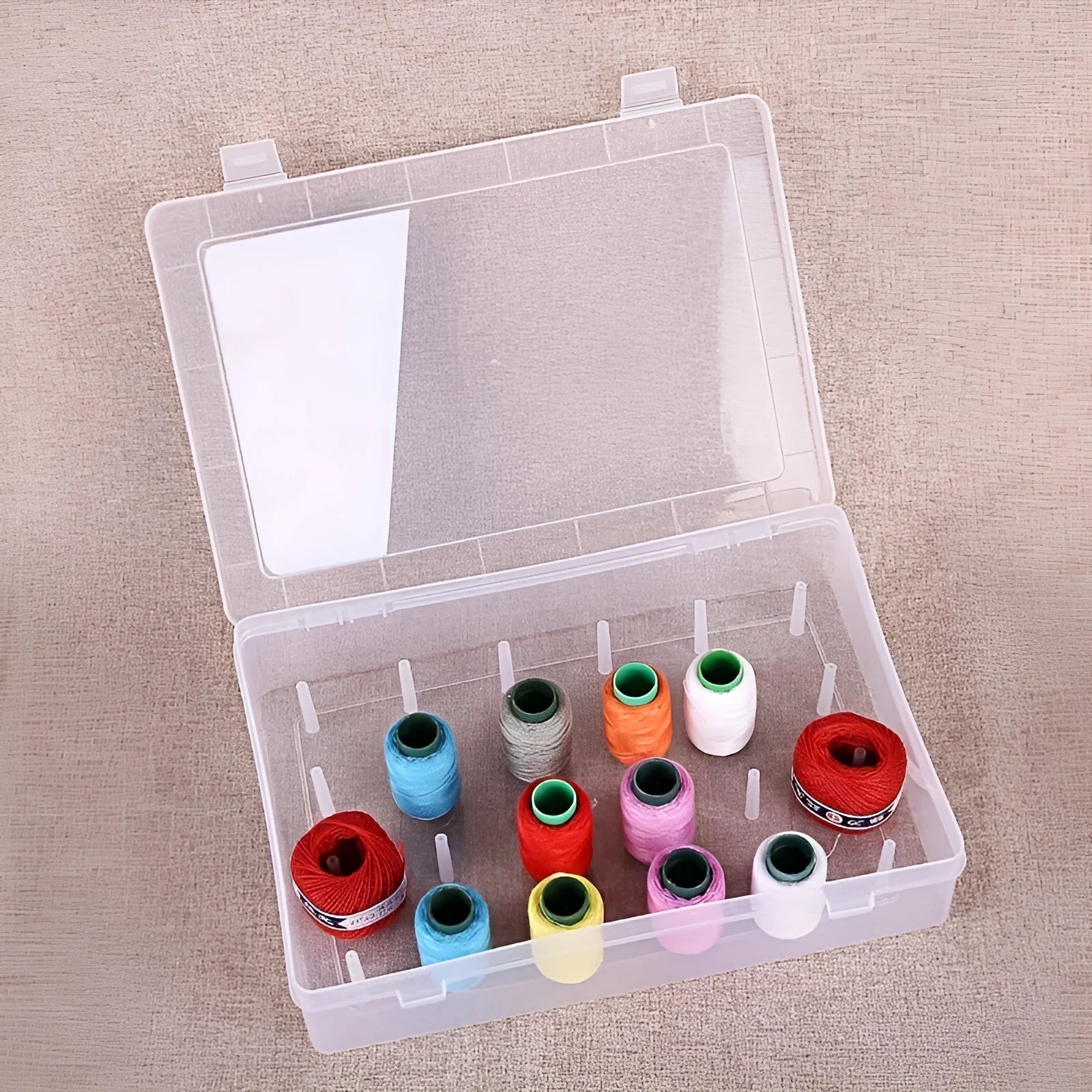 Transparent plastic storage box with 42 compartments for embroidery threads and sewing supplies