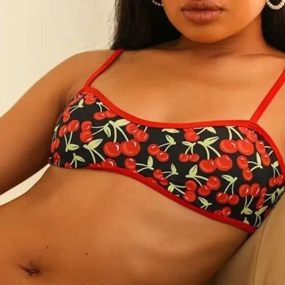 Women's cherry print floral polyester bikini swimsuit set with tube top and briefs.