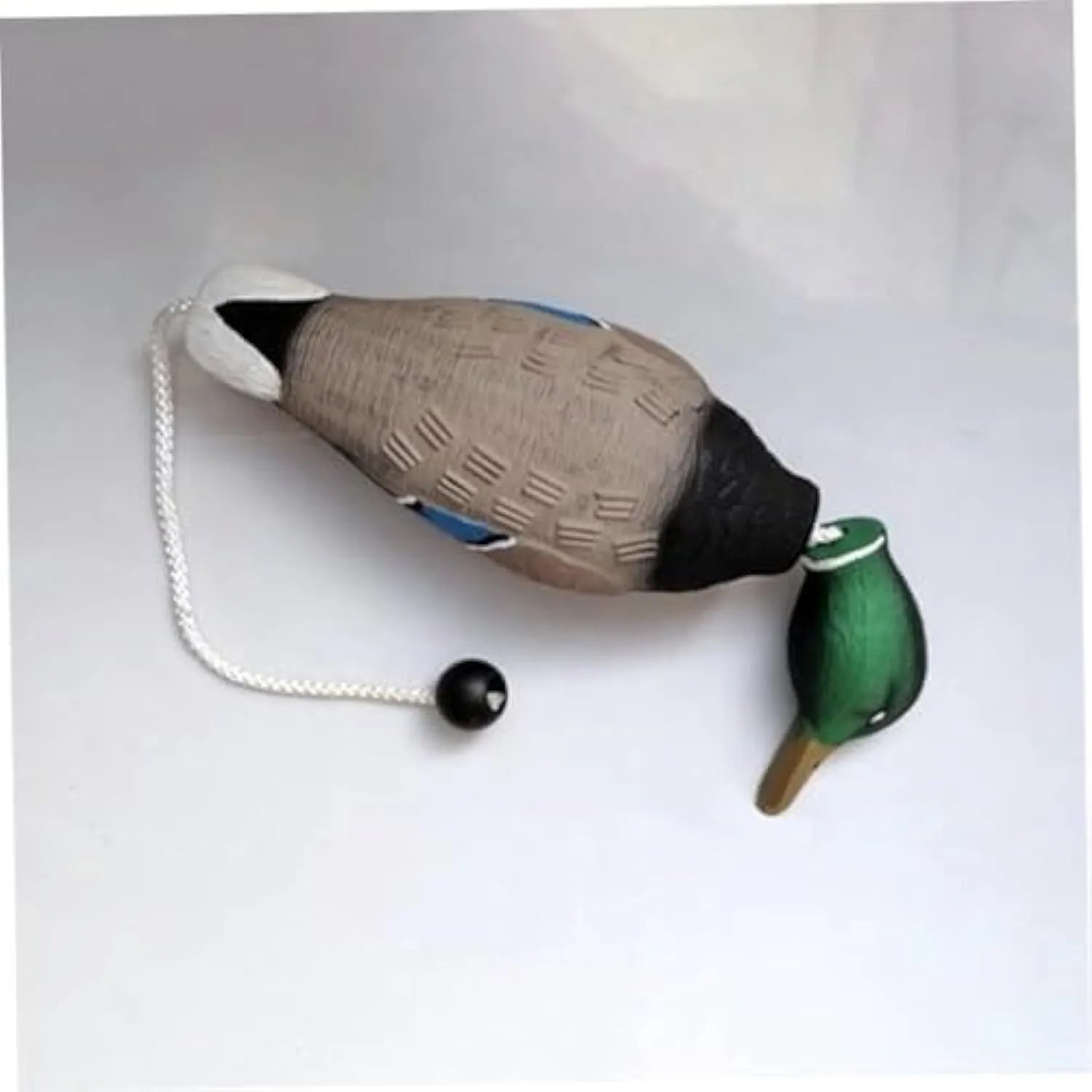Green EVA duck dog toy with no stuffing and quacking sound, 35cm long, on white background