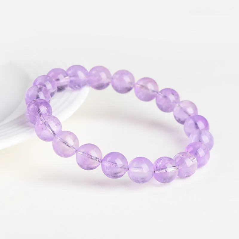 Lavender amethyst bracelet with water ripple texture on round beads in unisex design.